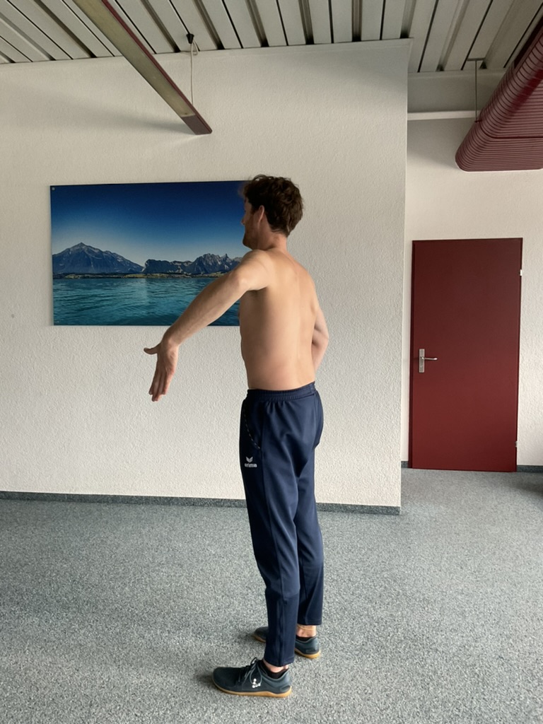 man doing internal rotation of the shoulder in 90 degrees abduction