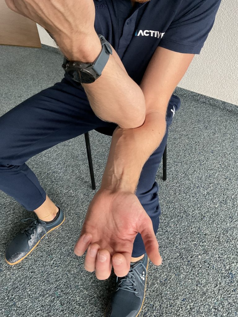 self massage elbow with other elbow
