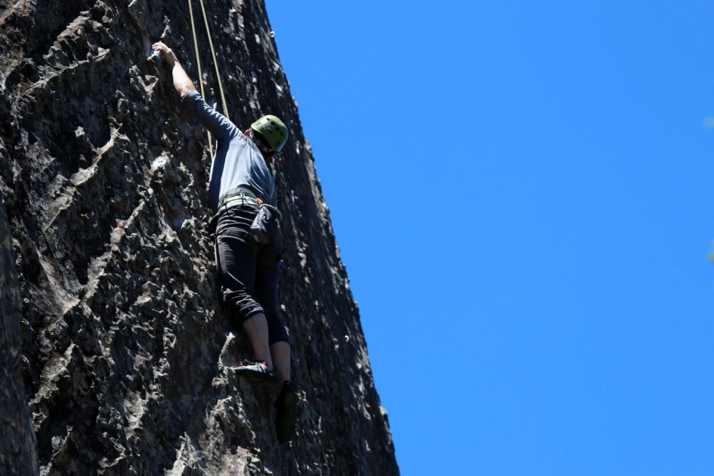 rock climber climbing top rope